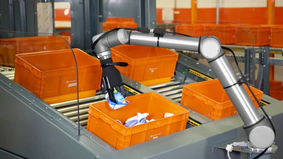 A robotic arm adding products into a box